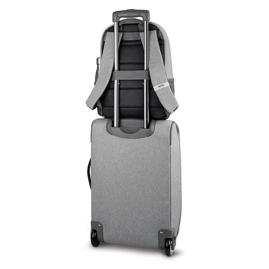 Solo Re:treat Carry-on in grey with Solo backpack attached to suitcase handle 