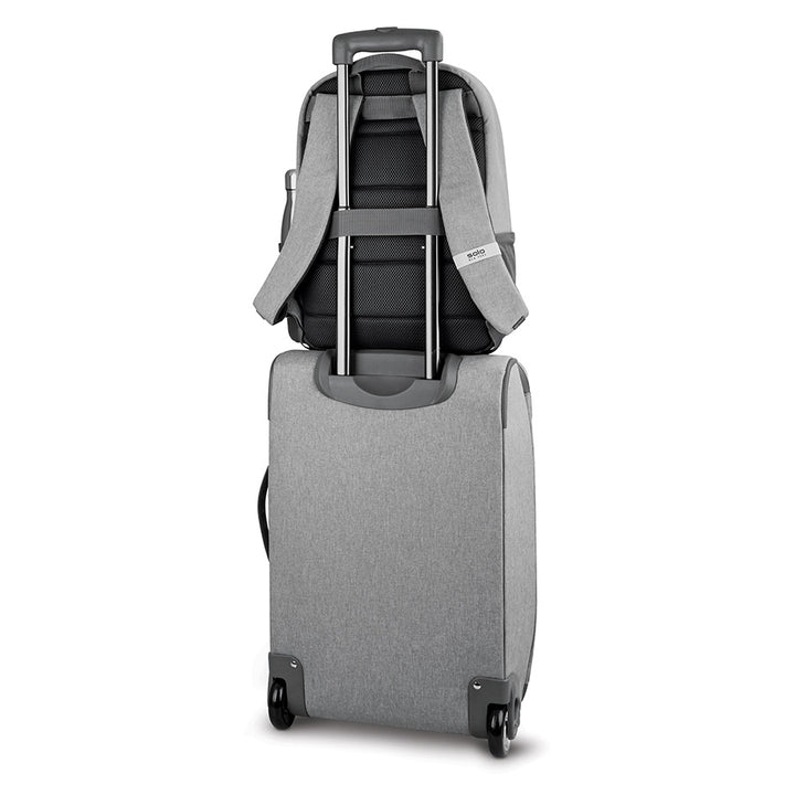 Solo Re:treat Carry-on in grey with Solo backpack attached to suitcase handle 